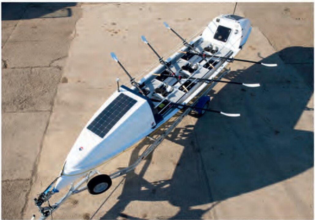 Crew rowing the ocean row boat with End Veteran Suicide branding